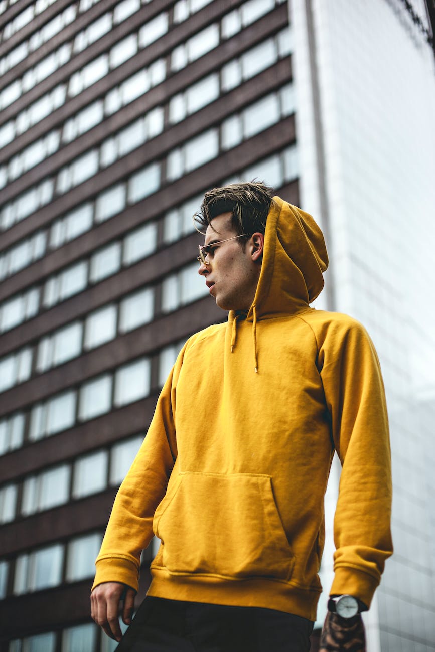 photography of guy wearing yellow hoodie